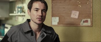 Movie still from “The Disappearance of Alice Creed” (2009), directed by J Blakeson – A person wearing a jacket; Close Up shot, Low angle