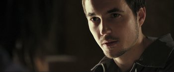 Movie still from “The Disappearance of Alice Creed” (2009), directed by J Blakeson – A man's face in a dark room; Close Up shot, Over the shoulder angle