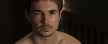 Movie still from “The Disappearance of Alice Creed” (2009), directed by J Blakeson – A person with a beard; Close Up shot, Over the shoulder angle