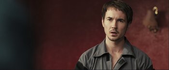 Movie still from “The Disappearance of Alice Creed” (2009), directed by J Blakeson – A person wearing a jacket; Close Up shot, Low angle