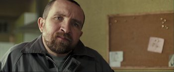 Movie still from “The Disappearance of Alice Creed” (2009), directed by J Blakeson – A person with a beard; Close Up shot, Low angle