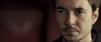 Movie still from “The Disappearance of Alice Creed” (2009), directed by J Blakeson – A man with a mustache; Close Up shot, Over the shoulder angle
