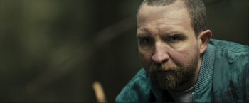 Movie still from “The Disappearance of Alice Creed” (2009), directed by J Blakeson – A person with a beard; Close Up shot, Over the shoulder angle