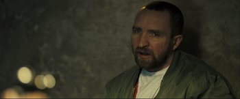 Movie still from “The Disappearance of Alice Creed” (2009), directed by J Blakeson – A person with a beard; Close Up shot, Over the shoulder angle