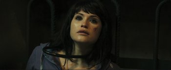 Movie still from “The Disappearance of Alice Creed” (2009), directed by J Blakeson – A person with a knife in their mouth; Close Up shot, High angle