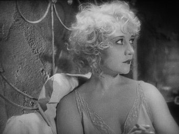 Movie still from “The Docks of New York” (1928), directed by Josef von Sternberg – A black - and - white photo of a woman in a negligee; Close Up shot, High angle