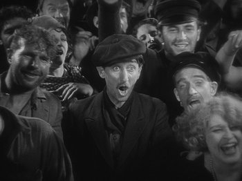 Movie still from “The Docks of New York” (1928), directed by Josef von Sternberg – A group of people that are standing in a crowd; Medium shot, High angle
