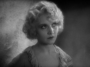 Movie still from “The Docks of New York” (1928), directed by Josef von Sternberg – An old black and white photo of a woman; Close Up shot, High angle