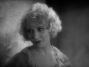 Movie still from “The Docks of New York” (1928), directed by Josef von Sternberg – An old photo of a woman in a short dress; Close Up shot, High angle