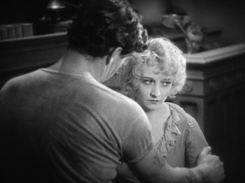 Movie still from “The Docks of New York” (1928), directed by Josef von Sternberg – A man and a woman looking at one another in a mirror; Medium shot, High angle