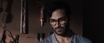 Movie still from “The Domestics” (2018), directed by Mike P. Nelson – A person wearing glasses; Close Up shot, Over the shoulder angle