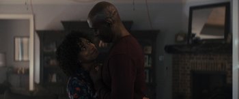 Movie still from “The Domestics” (2018), directed by Mike P. Nelson – A man and a woman standing next to each other; Medium shot, Low angle