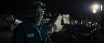 Movie still from “The Domestics” (2018), directed by Mike P. Nelson – An older man wearing goggles and a jacket; Close Up shot, Low angle