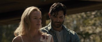 Movie still from “The Domestics” (2018), directed by Mike P. Nelson – A man and a woman standing next to each other; Close Up shot, Over the shoulder angle