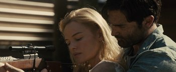 Movie still from “The Domestics” (2018), directed by Mike P. Nelson – A man and a woman looking at a cell phone; Close Up shot, Low angle