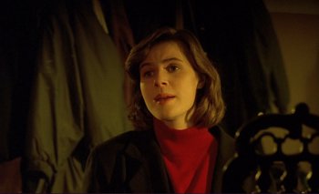 Movie still from “The Double Life of Véronique” (1991), directed by Krzysztof Kieslowski – A woman in a black jacket and a red shirt; Close Up shot, Low angle