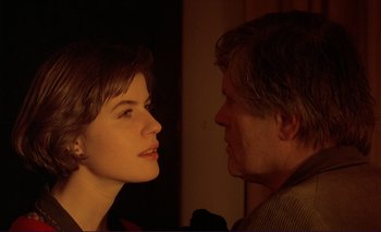 Movie still from “The Double Life of Véronique” (1991), directed by Krzysztof Kieslowski – A man and a woman face to face in the dark; Close Up shot, Over the shoulder angle