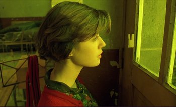 Movie still from “The Double Life of Véronique” (1991), directed by Krzysztof Kieslowski – A woman looking out of a window at night; Close Up shot, Over the shoulder angle
