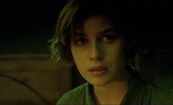 Movie still from “The Double Life of Véronique” (1991), directed by Krzysztof Kieslowski – A person with short brown hair; Close Up shot, High angle