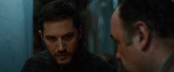 Movie still from “The Drop” (2014), directed by Michaël R. Roskam – A person looking at a mirror; Close Up shot, Over the shoulder angle