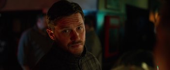 Movie still from “The Drop” (2014), directed by Michaël R. Roskam – A person with a beard; Close Up shot, Over the shoulder angle