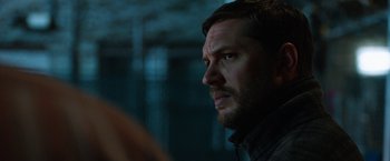 Movie still from “The Drop” (2014), directed by Michaël R. Roskam – A person looking at something; Close Up shot, Over the shoulder angle