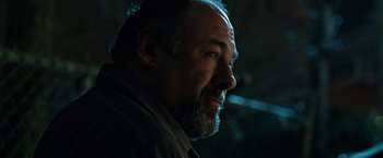 Movie still from “The Drop” (2014), directed by Michaël R. Roskam – A person with a beard; Close Up shot, Low angle