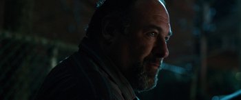 Movie still from “The Drop” (2014), directed by Michaël R. Roskam – A person with a beard; Close Up shot, Over the shoulder angle
