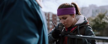 Movie still from “The Drop” (2014), directed by Michaël R. Roskam – A woman is writing on a piece of paper; Close Up shot, Over the shoulder angle