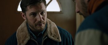 Movie still from “The Drop” (2014), directed by Michaël R. Roskam – A person wearing a jacket; Close Up shot, Over the shoulder angle