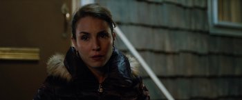 Movie still from “The Drop” (2014), directed by Michaël R. Roskam – A person wearing a jacket; Close Up shot, Over the shoulder angle