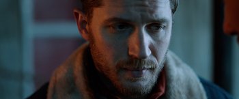 Movie still from “The Drop” (2014), directed by Michaël R. Roskam – A person with a beard; Close Up shot, Over the shoulder angle