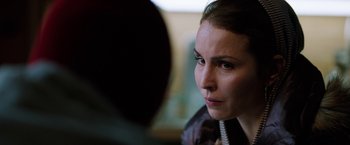 Movie still from “The Drop” (2014), directed by Michaël R. Roskam – A person with a phone; Close Up shot, Over the shoulder angle