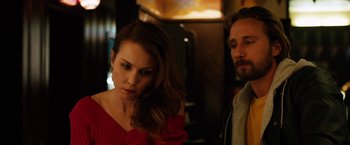 Movie still from “The Drop” (2014), directed by Michaël R. Roskam – A man and a woman standing next to each other; Close Up shot, Over the shoulder angle