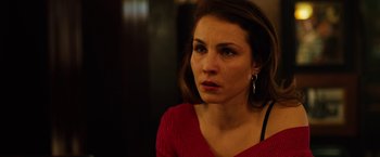 Movie still from “The Drop” (2014), directed by Michaël R. Roskam – A person wearing a red shirt; Close Up shot, Over the shoulder angle