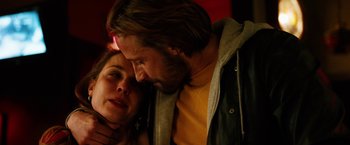 Movie still from “The Drop” (2014), directed by Michaël R. Roskam – A man and a woman sitting next to each other; Close Up shot, Low angle