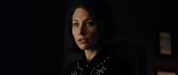 Movie still from “The Duke of Burgundy” (2014), directed by Peter Strickland – A person wearing a black shirt; Close Up shot, Low angle