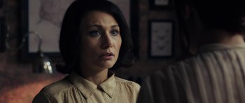 Movie still from “The Duke of Burgundy” (2014), directed by Peter Strickland – A person wearing a dress shirt; Close Up shot, Over the shoulder angle