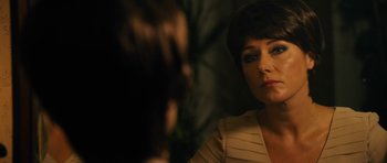 Movie still from “The Duke of Burgundy” (2014), directed by Peter Strickland – A person looking at a mirror; Close Up shot, Over the shoulder angle