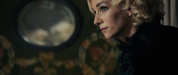 Movie still from “The Duke of Burgundy” (2014), directed by Peter Strickland – A person looking at a mirror; Close Up shot, Over the shoulder angle