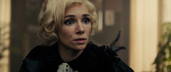 Movie still from “The Duke of Burgundy” (2014), directed by Peter Strickland – A person with blonde hair; Close Up shot, Over the shoulder angle