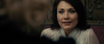 Movie still from “The Duke of Burgundy” (2014), directed by Peter Strickland – A person wearing a white shirt; Close Up shot, Over the shoulder angle