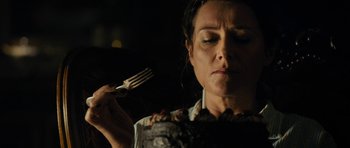 Movie still from “The Duke of Burgundy” (2014), directed by Peter Strickland – A woman holding a fork in her hand; Close Up shot, Overhead angle