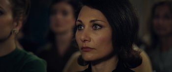 Movie still from “The Duke of Burgundy” (2014), directed by Peter Strickland – A woman's face as she stares into the distance; Close Up shot, Over the shoulder angle