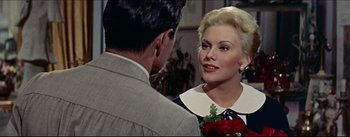 Movie still from “The Eddy Duchin Story” (1956), directed by George Sidney – A man and a woman talking to each other; Close Up shot, Over the shoulder angle