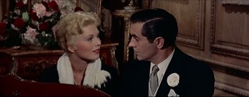 Movie still from “The Eddy Duchin Story” (1956), directed by George Sidney – A man and a woman are talking to each other; Close Up shot, Over the shoulder angle