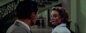 Movie still from “The Eddy Duchin Story” (1956), directed by George Sidney – A man and a woman are looking at one another; Close Up shot, Over the shoulder angle