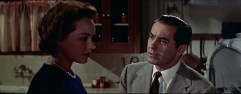 Movie still from “The Eddy Duchin Story” (1956), directed by George Sidney – A man and a woman are talking in a kitchen; Close Up shot, Over the shoulder angle