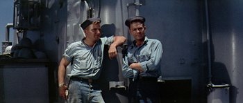 A couple of men standing next to each other