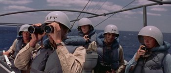 A group of people in helmets on a boat